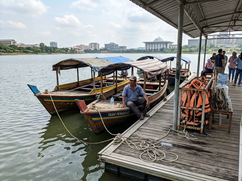 Traditional covered perahu boats moored at the Putrajaya lake jetty