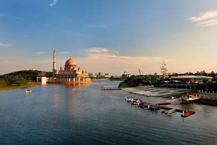 Boats moored at the Putrajaya cruise jetty with the Putra Mosque across the water
